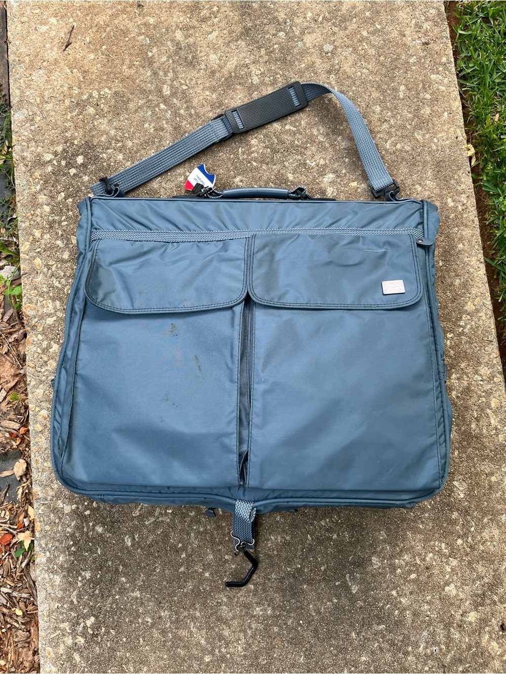 American Tourister  Navy Garment Bag with Shoulder Strap Great condition.
